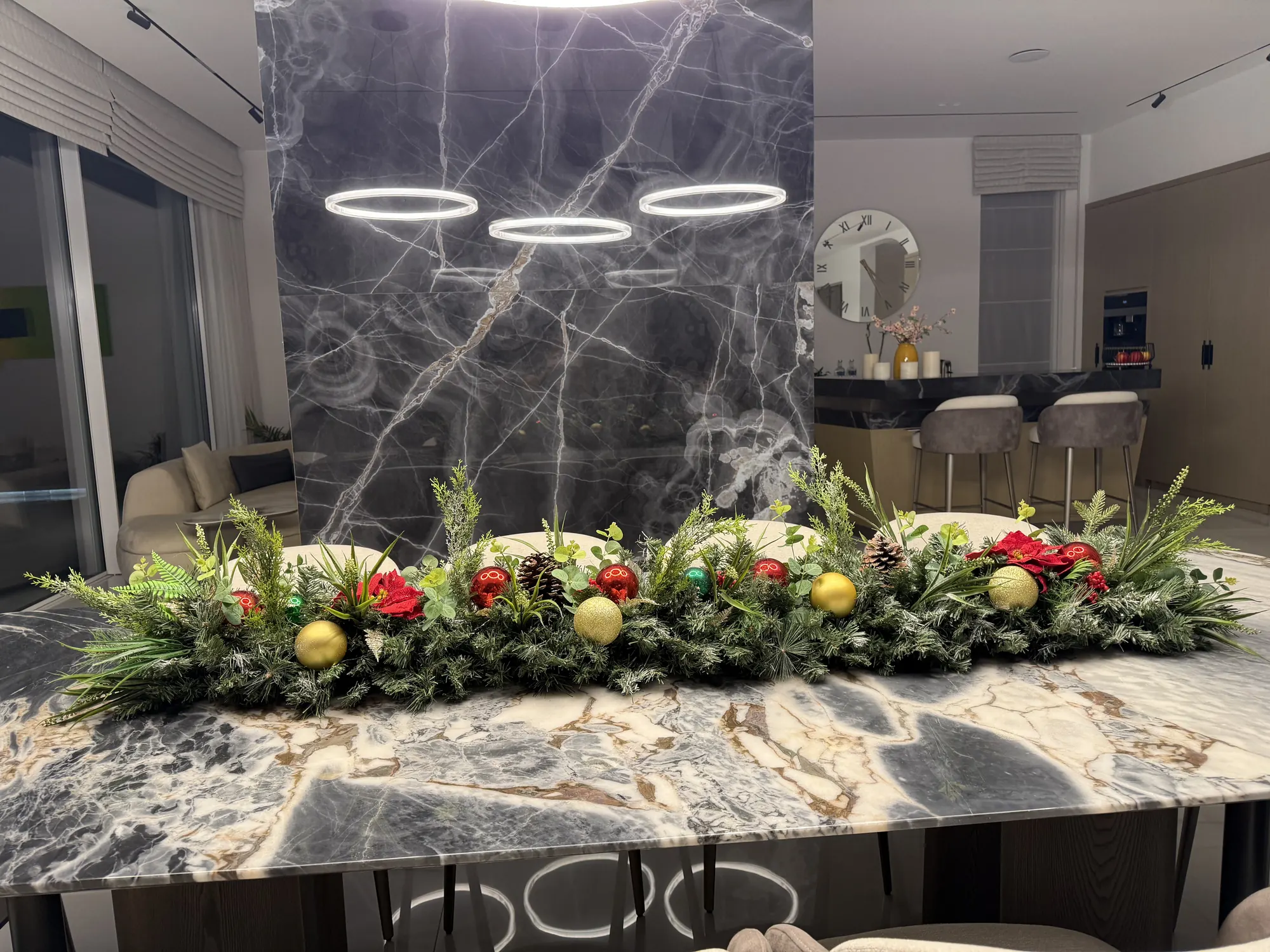 A long garland centrepiece on a marble dining table
